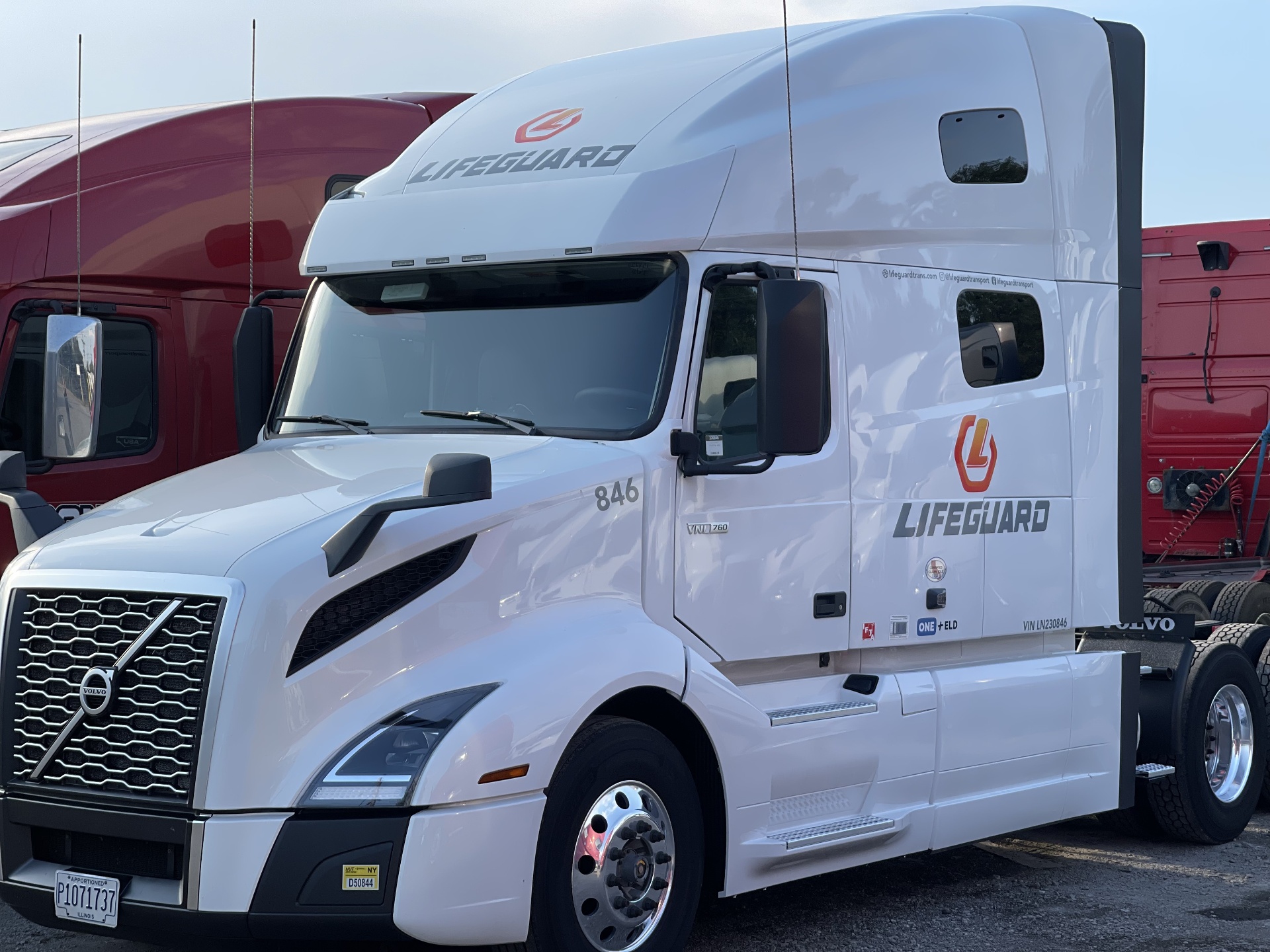 White Volvo VNL 760 tractor 846 with Lifeguard branding